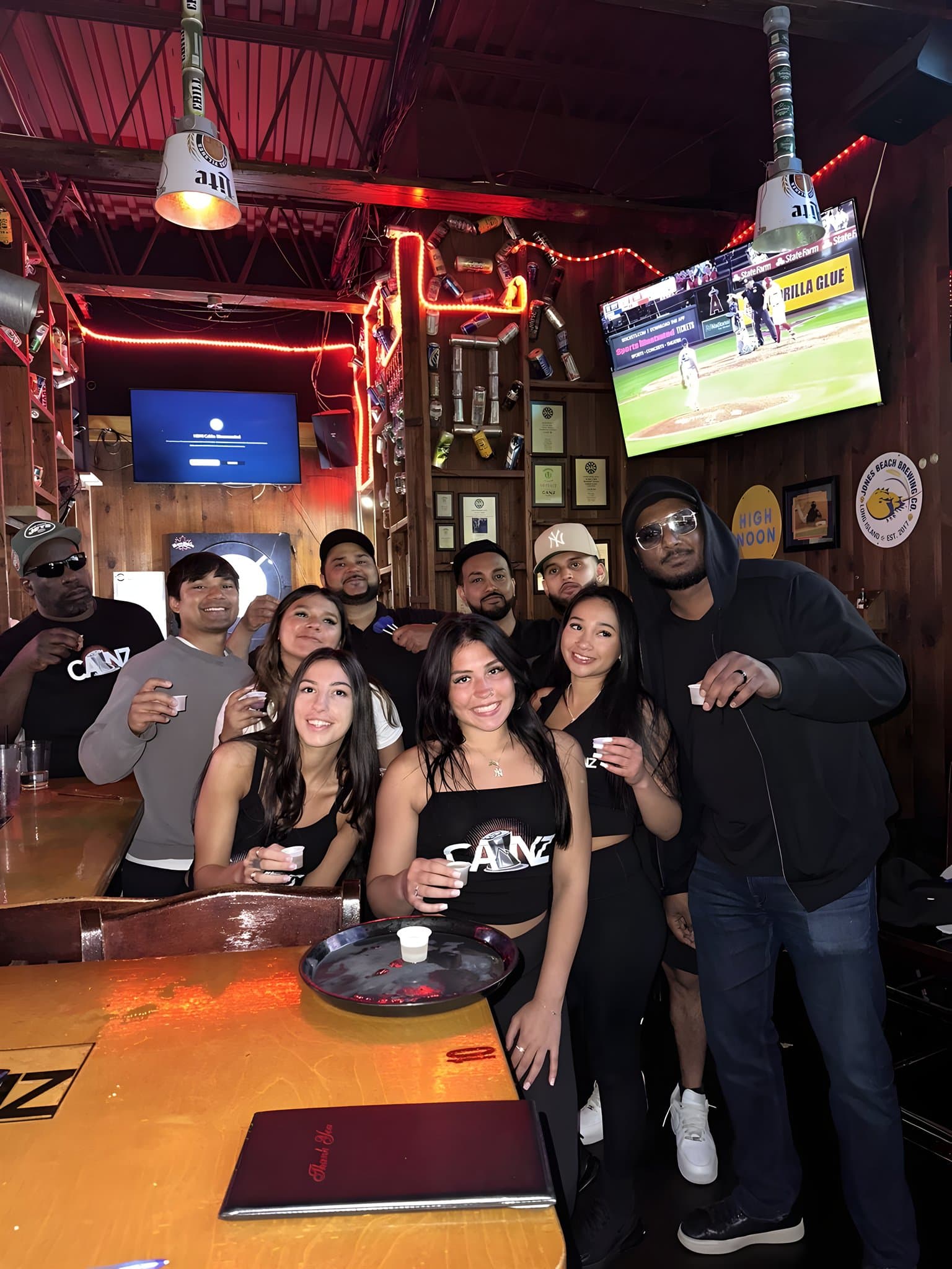 A group raising a toast at the bar