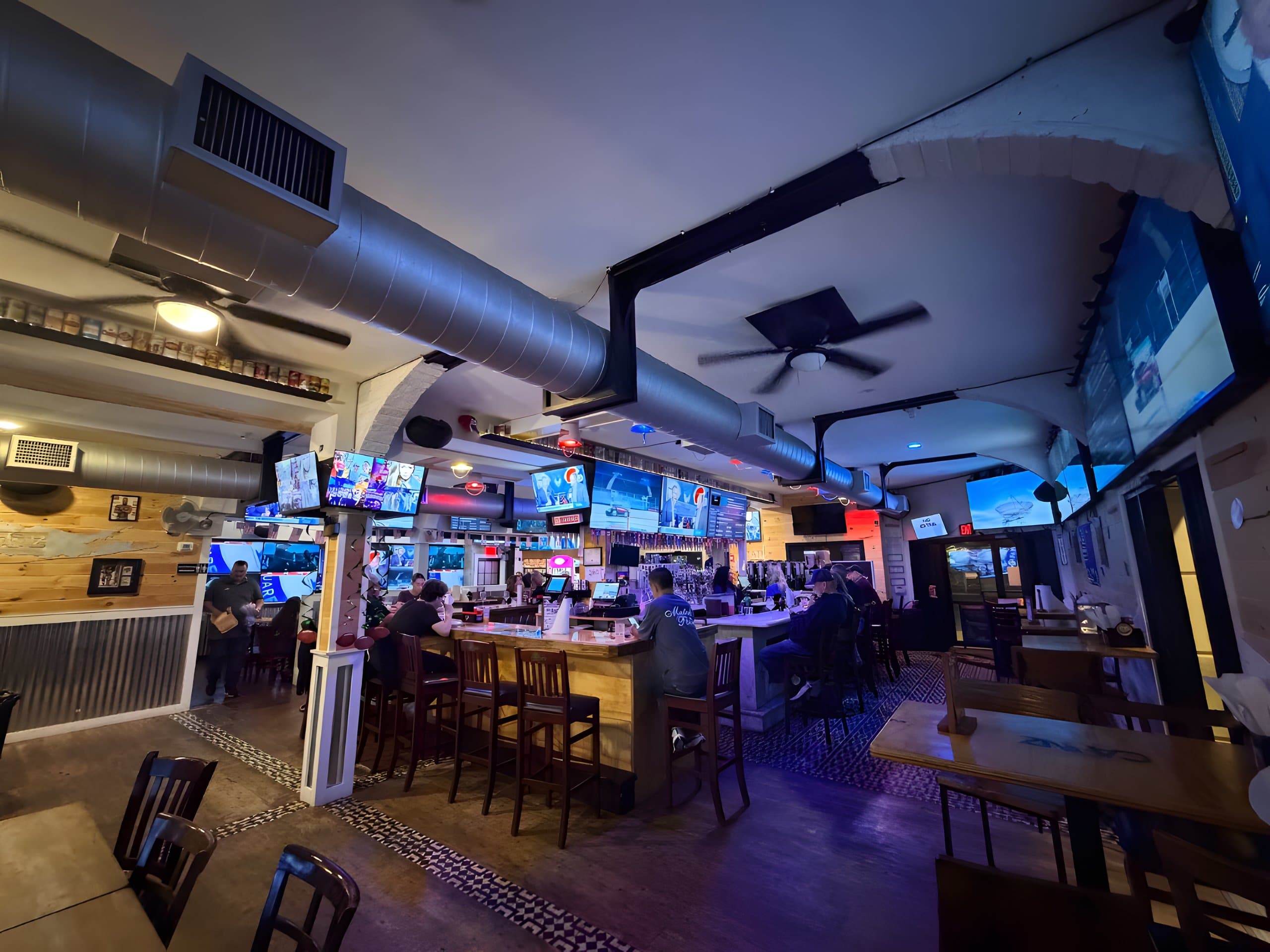 The bar and game-day screens at Canz Long Beach